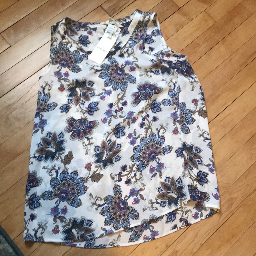 Silk creme and blue sleeveless blouse.